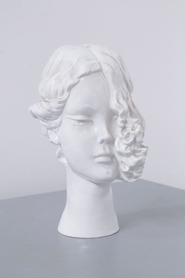 White ceramic face sculpture