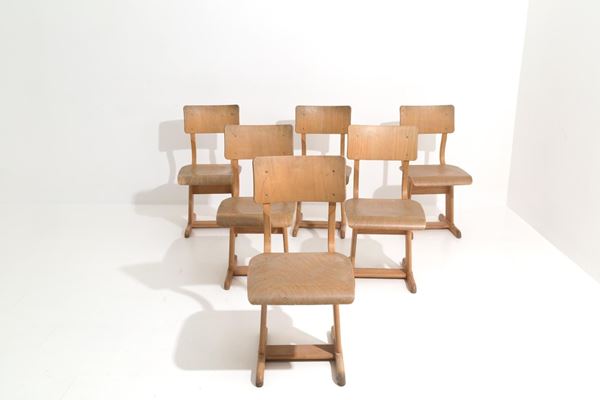 Six Vintage wooden school chairs.