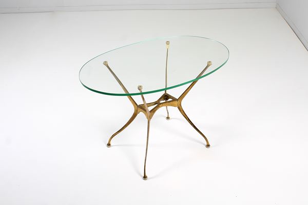 Cesare Lacca - Coffee table con piano ovale in vetro e struttura a gittata in ottone dorato attr. a Cesare Lacca