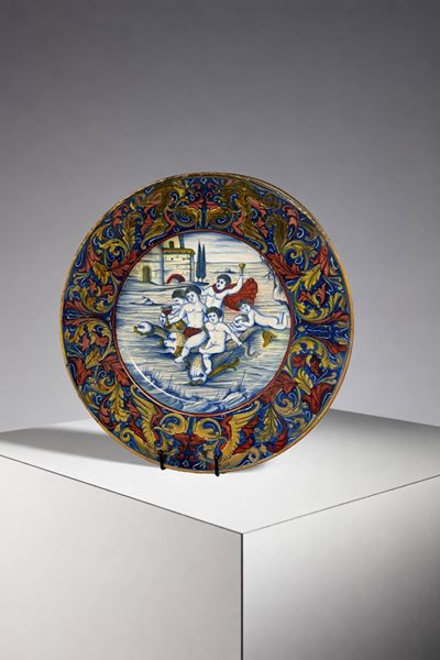 Piatto in maiolica policroma firmato
