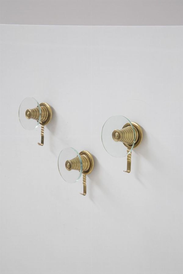 three Italian wall hangers in brass and glass