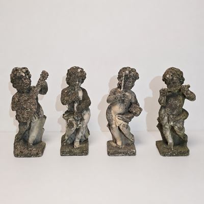 Quattro Putti in impasto di pietra